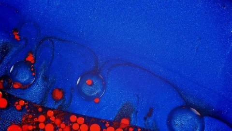 Wave of red washes over blue 1 vibrant bright paint and oil color swirls entropy Stock Footage 81942286