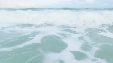 Wave rolling towards the surface until foaming appeared around surface water sea Stock Footage 193985812