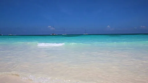 A wave rolling on the white sand of a Caribbean island. Stock Footage 96240474