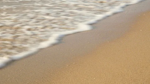Wave rolls on beach Stock Footage 114993008