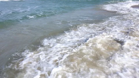 Wave rolls over the shore with seashells Stock Footage 88904287