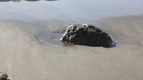 A wave rolls on a stone Stock Footage 106326972