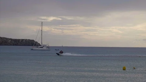 Wave runner in cloudy weather Stock Footage 98386686