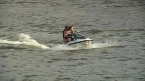 Wave runner couple on lake 2 Stock Footage 39963180