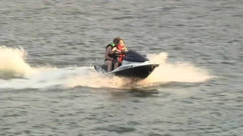 Wave runner couple on lake 4 Stock Footage 39963164