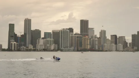 Wave Runner Jetski Passes Miami Skyline Stock Footage 316421272