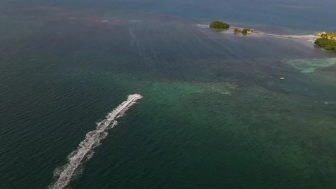 Wave Runner On Ocean Reef Caribbean Cayes Drone Shot 4K Stock Footage 114839524