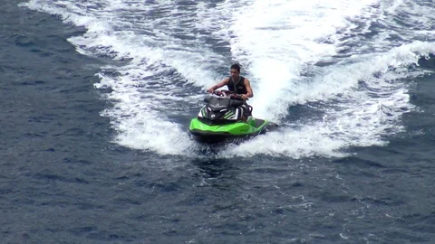 Wave runners sailing along the north coast of Benidorm in Spain. Stock Footage 113532288