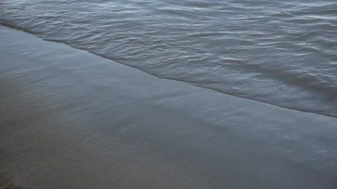 The wave runs onto the sandy shore Stock Footage 155436855