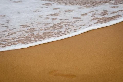 Wave on the sand beach Stock Photos