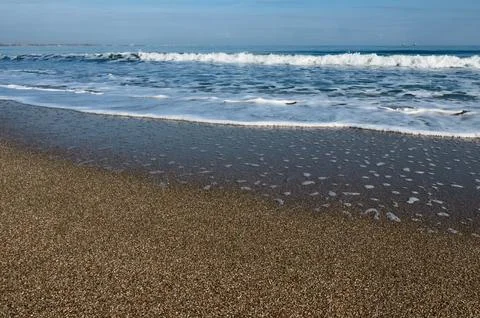 Wave on the sand beach Stock Photos