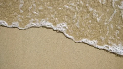 Wave on the sand beach top view background Stock Footage 101934497