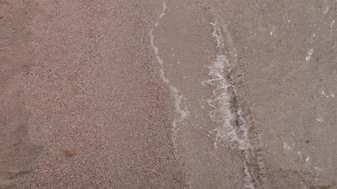 Wave on the sand beach top view background Stock Footage 154334713