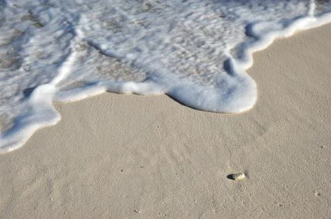 Wave on sand Stock Photos