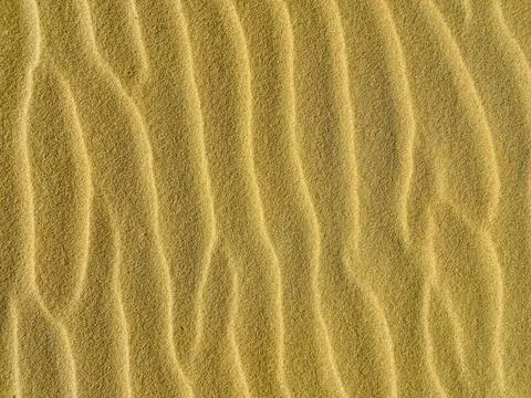Wave sand texture, desert background sandy beach Stock Photos