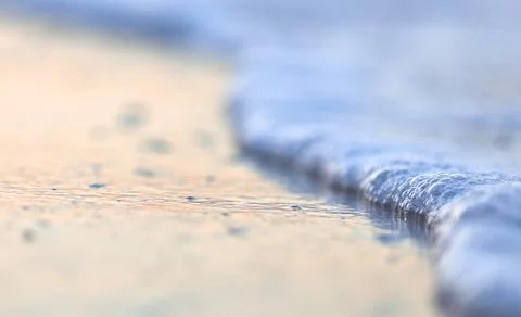Wave On Sandy Beach. Background. Splash of waves on the sandy beach. foam, su Stock Photos