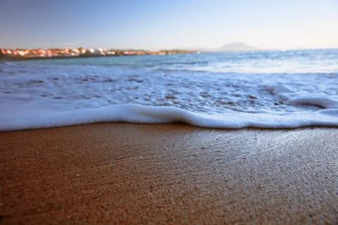 Wave On Sandy Beach. Background. Splash of waves on the sandy beach. foam, su Stock Photos