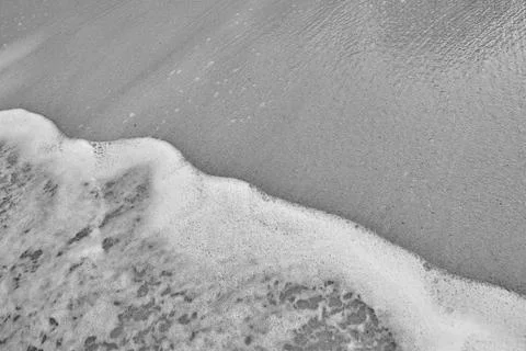 Wave On Sandy Beach. Background. Splash of waves on the sandy beach. foam, su Stock Photos