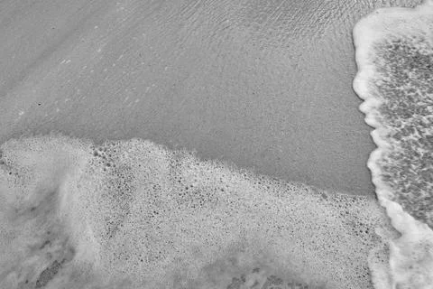 Wave On Sandy Beach. Background. Splash of waves on the sandy beach. foam, su Stock Photos