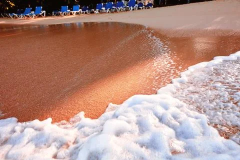 Wave On Sandy Beach. Background. Splash of waves on the sandy beach. foam, su Stock Photos