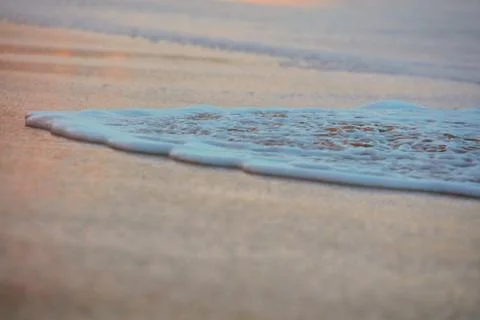 Wave On Sandy Beach. Background. Splash of waves on the sandy beach. foam, su Stock Photos