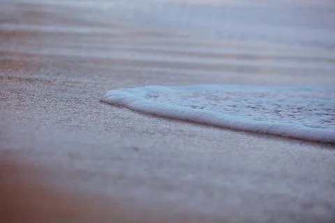 Wave On Sandy Beach. Background. Splash of waves on the sandy beach. foam, su Stock Photos