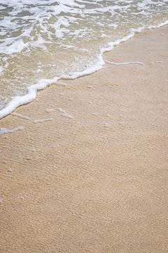 Wave on sandy beach with copy space for your text, high angle view background Foto stock