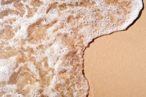 Wave on sandy beach Stock Photos