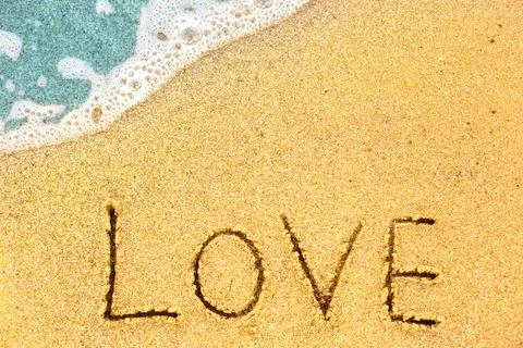 Wave on sandy beach Stockfoto's