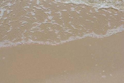 Wave on Sandy Beach Stock Photos