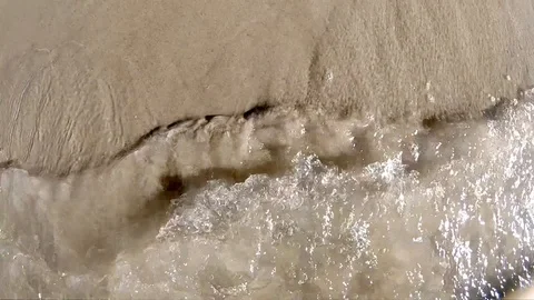 Wave on a sandy shore Stock Footage 116563184