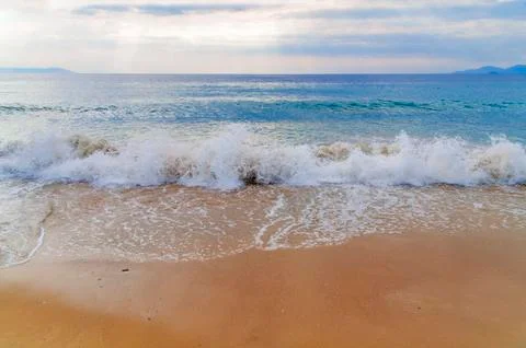 Wave on sea with beach background Stock Photos