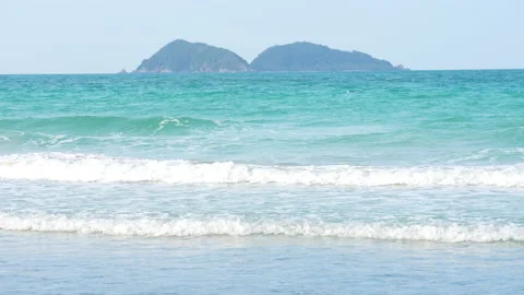 Wave sea on beach of slow motion on summer of sunny background Stockbeeldmateriaal 238741066