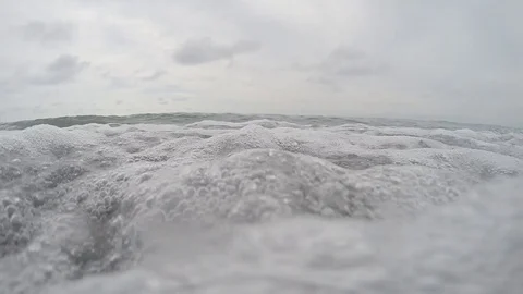 A wave of the sea covers the camera. Underwater view Stock Footage 127734710