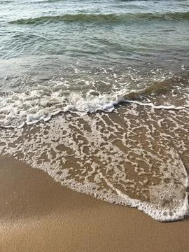 Wave of sea with foam. Stock Photos