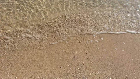 Wave of the sea on the sandy beach Stock Footage 90276907