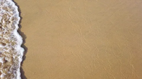 Wave of the sea on the sandy beach Stock Footage 126847555