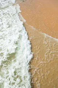 Wave of the sea on the sandy beach 写真素材