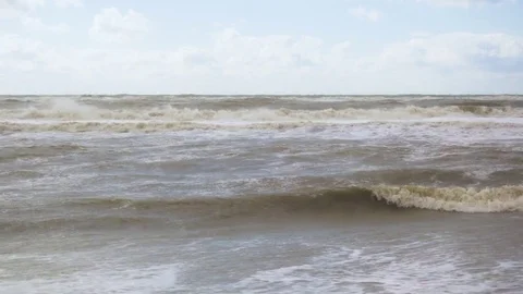 The wave on the shore and in the sea is twisted Stock Footage 82308653