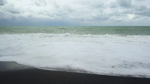 The wave slides back into the sea to meet another wave Video stock 82027056