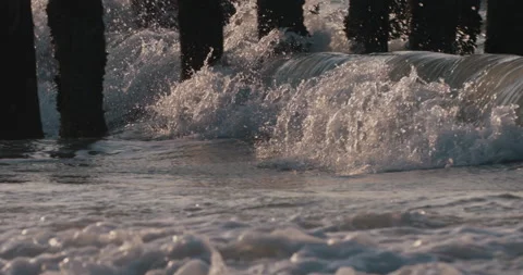 Wave slowmotion breaking sunset 4k Stock Footage 153501278