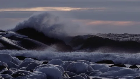 Wave splash over the rock after sunset Video stock 94683572