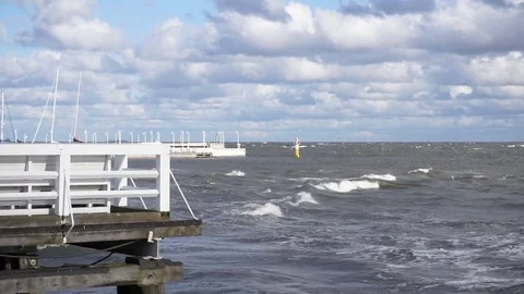 Wave splash at the pier on a stormy day Stock Footage 69754096