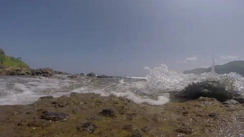 Wave Splashing on The Beach Rocks Stock Footage