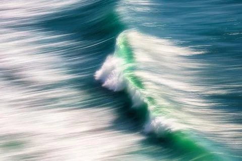 Wave splashing with in camera panning technique Stock Photos