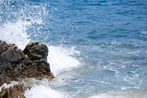 Wave splashing on a rock 스톡 사진