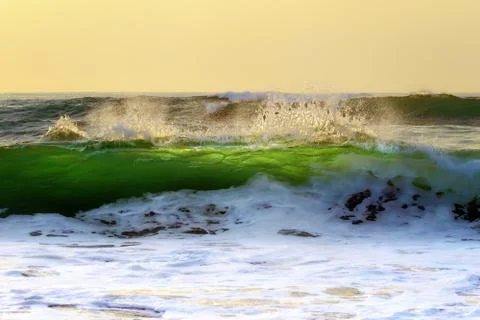 Wave splashing on shore Stock Photos