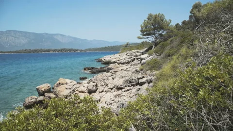 Wave splasing about stones on mediterranean sea. 4K Stock Footage 92991824