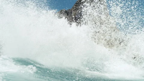 Wave Spray Explodes Over Coastal Ridge, Slowmo Stock Footage 317846365
