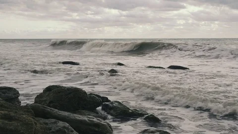 Wave on a stony shore after a storm Stock Footage 81558130